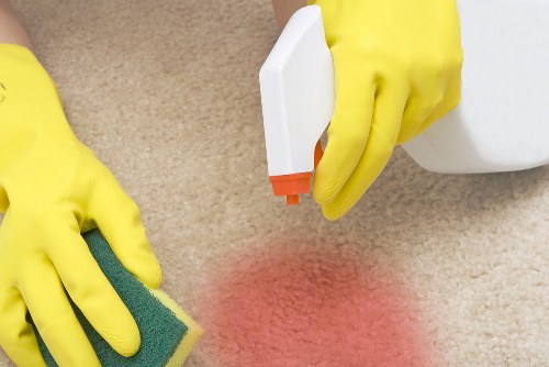 Professional cleaners working in a Lewisham home kitchen