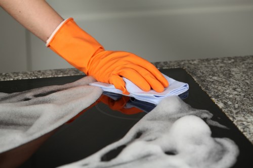 Domestic cleaner working in a Lewisham home kitchen