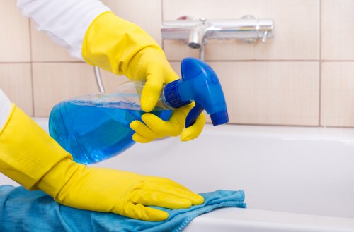 Local cleaners maintaining a hygienic office kitchen and communal area